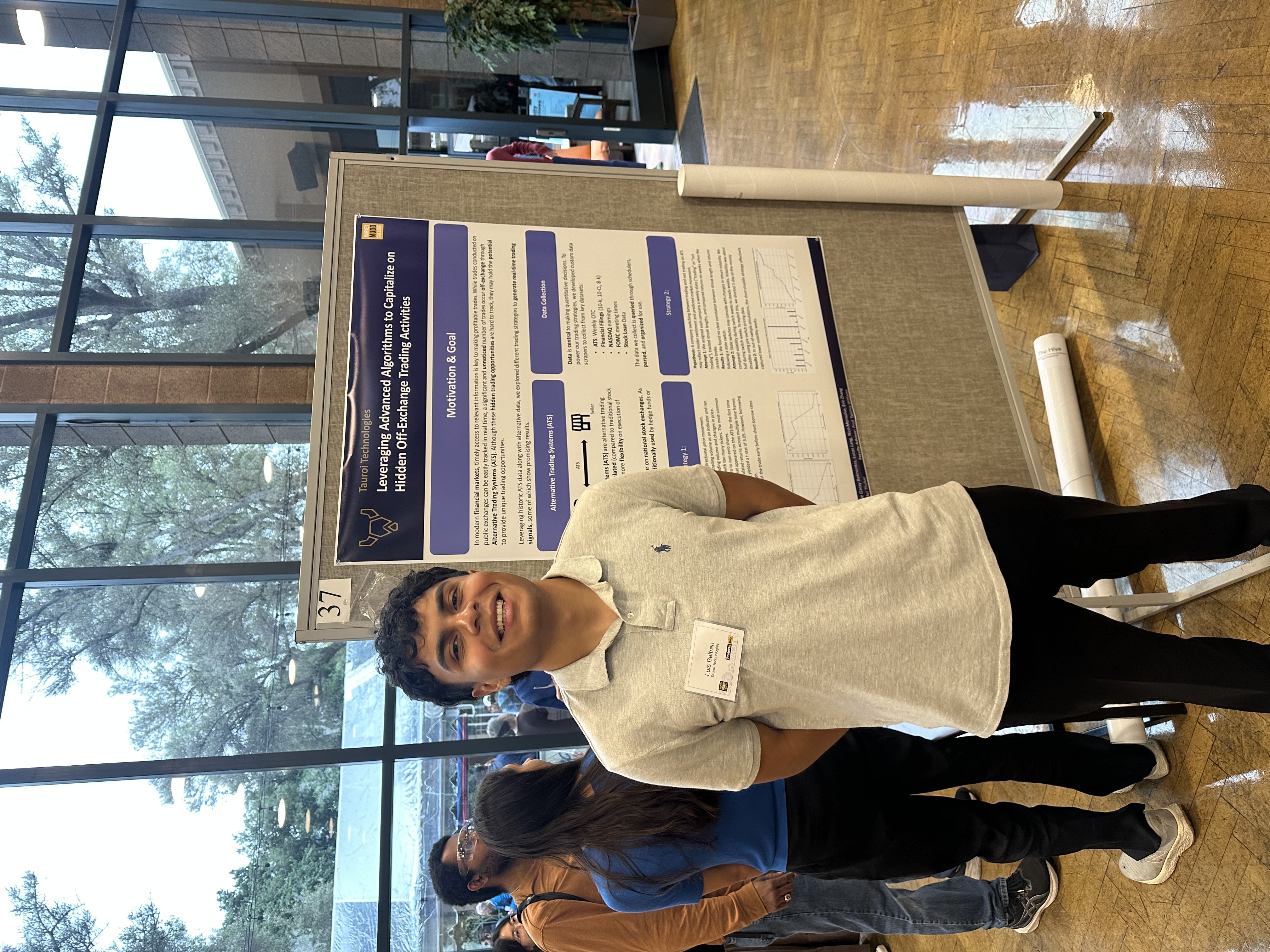 Luis Beltran presenting research on algorithmic trading at academic poster session